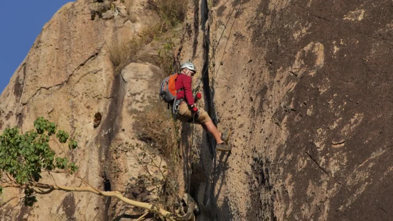 Stock Video Mountaineer Descending A Rocky Mountain Live Wallpaper - Free Download