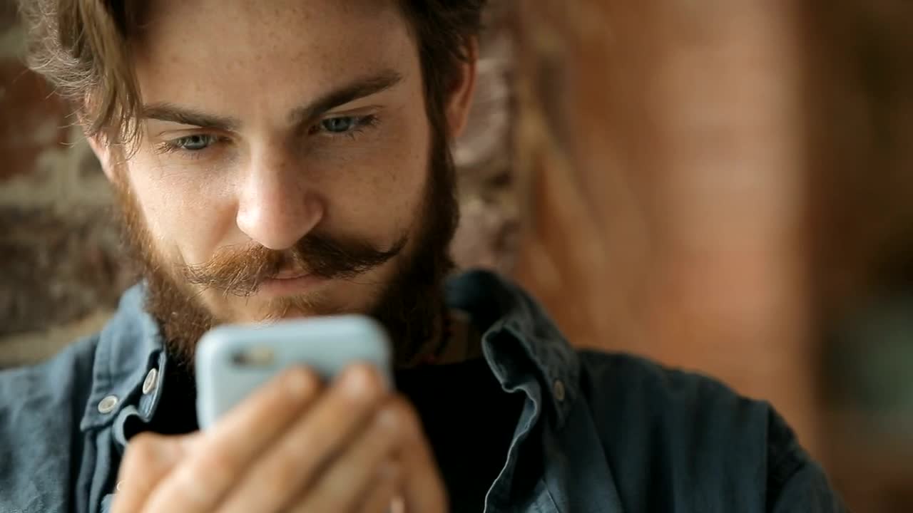 Stock Footage Urban Man Browses Web On Mobile Phone Live Wallpaper - Free Download