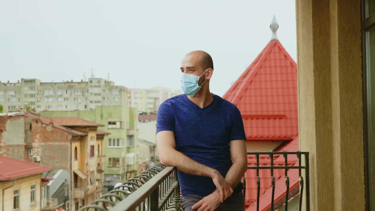 Stock Video Depressed Man Stands On Balcony In Face Mask Live Wallpaper For PC - Free Download
