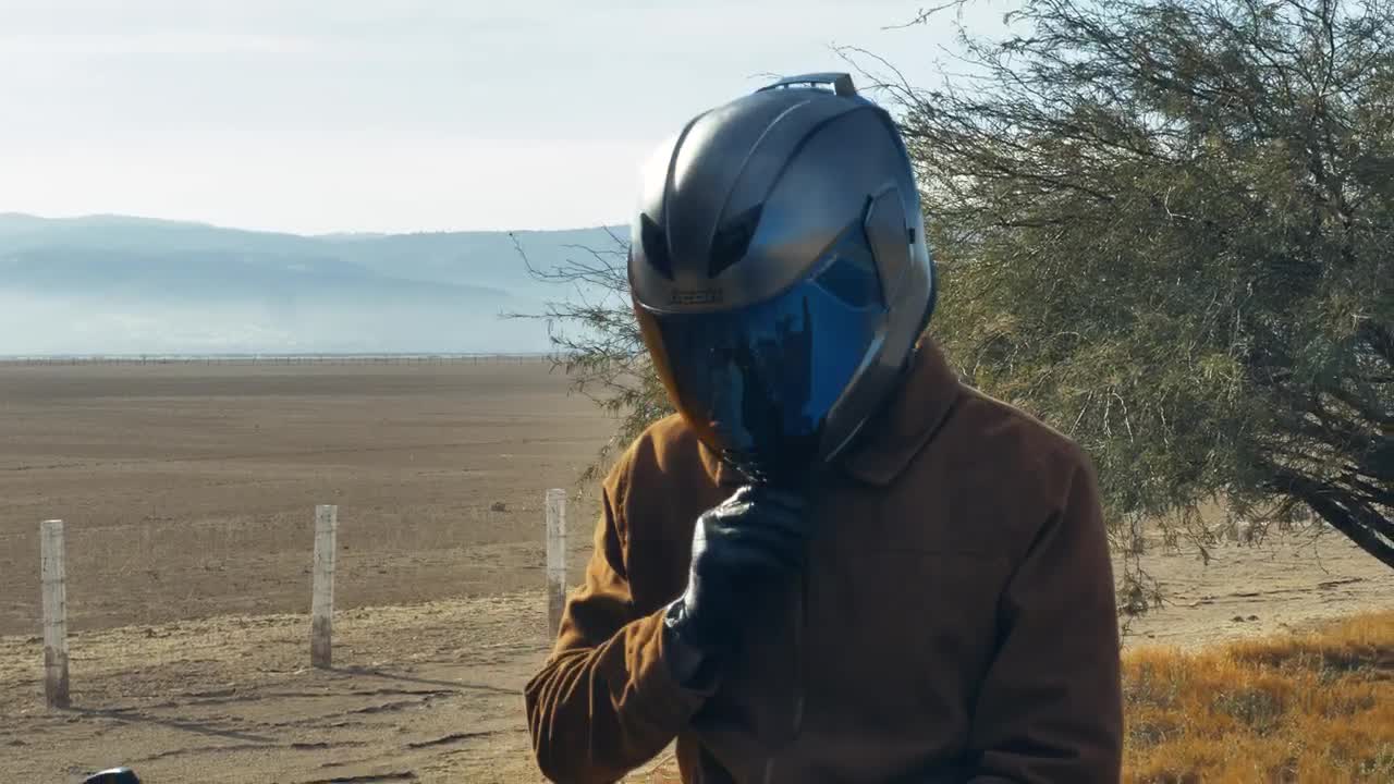 Stock Video Motorcyclist On The Side Of A Road Before Setting Off Live Wallpaper - Free Download
