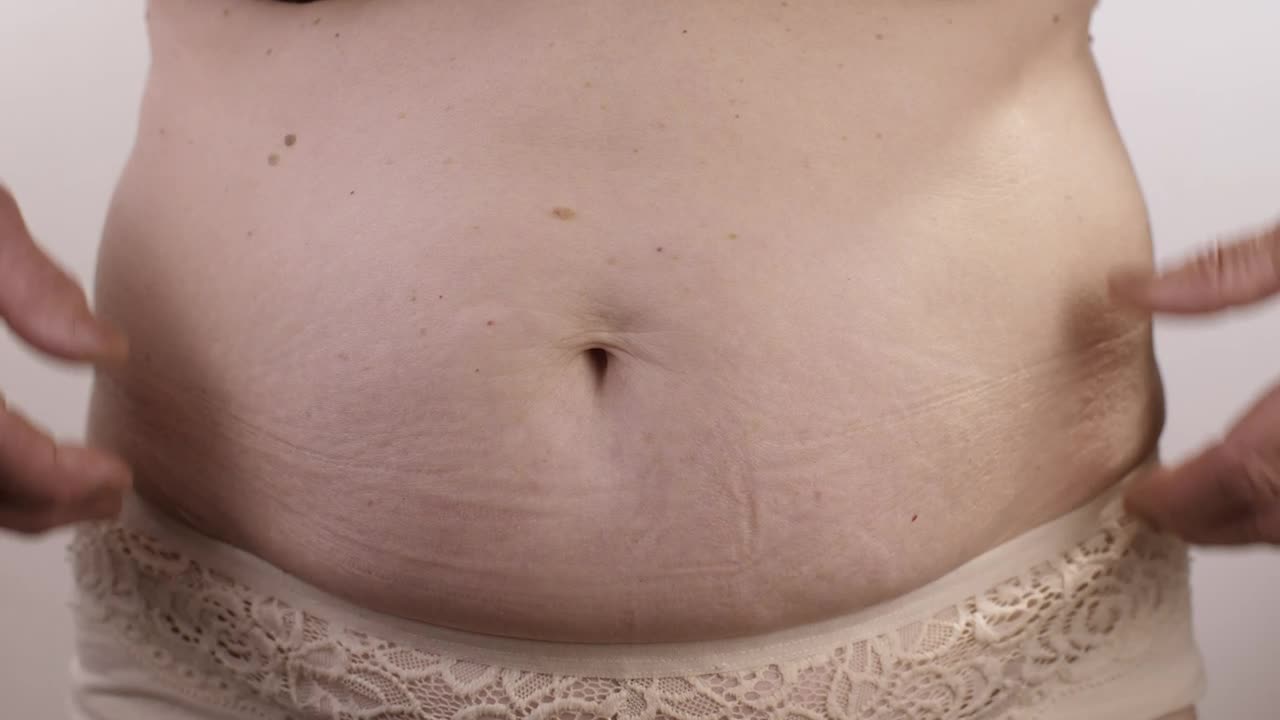 Stock Video Obese Woman Touching Her Stomach Live Wallpaper - Free Download