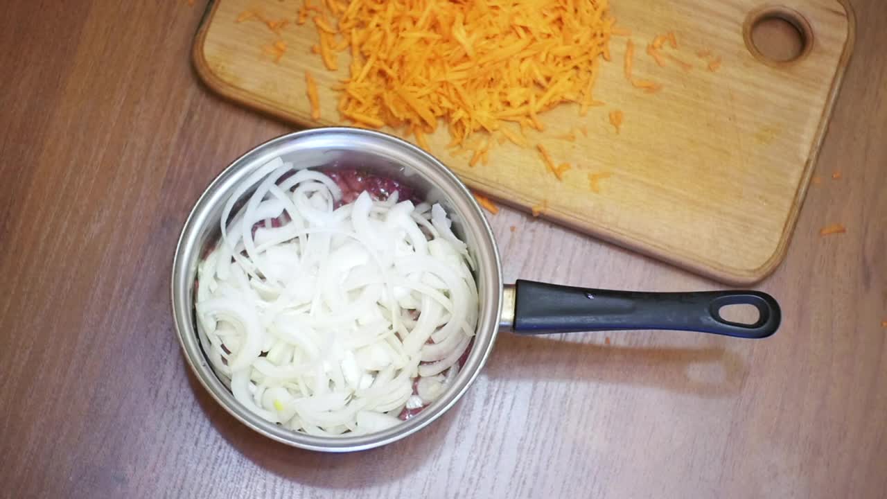 Stock Video Person Adding Grated Carrot To A Recipe Live Wallpaper - Free Download