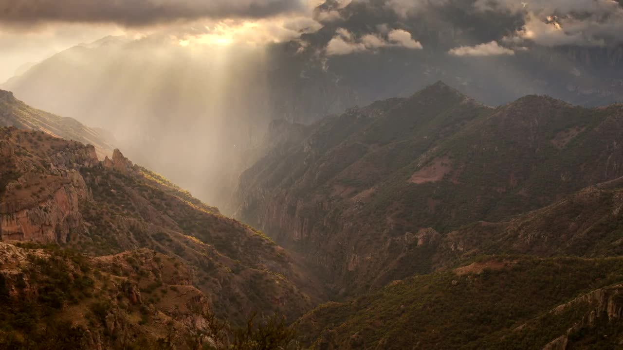Free Video Stock Sun Rays Pass Through The Clouds In The Mountains Live Wallpaper - Free Download