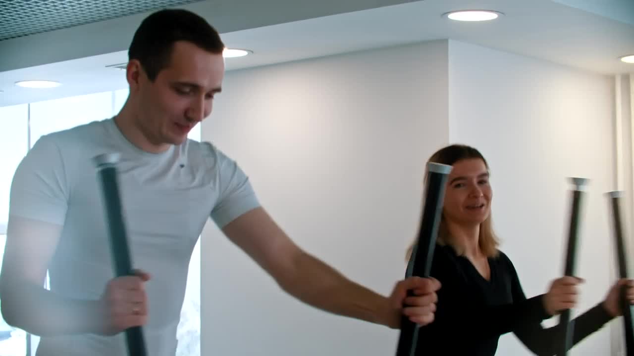 Stock Video Couple Of Friends Doing Cardio Exercise In The Gym Live Wallpaper For PC - Free Download