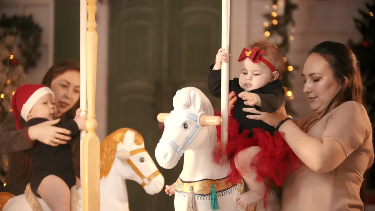 Stock Video Mothers With Their Daughters On A Christmas Carousel Live Wallpaper - Free Download