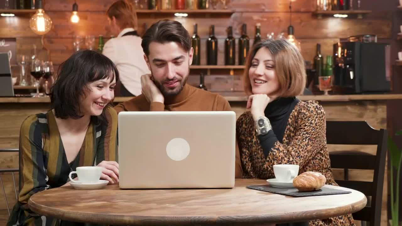 Free Video Stock Stylish Friends Share Ideas At Hip Cafe With Laptop Live Wallpaper - Free Download