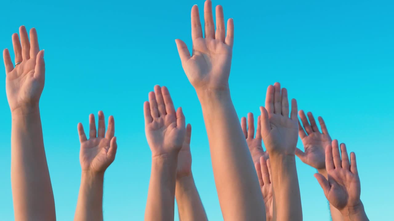 Stock Video Hands Held Up Against A Blue Sky Animated Wallpaper - Free Download