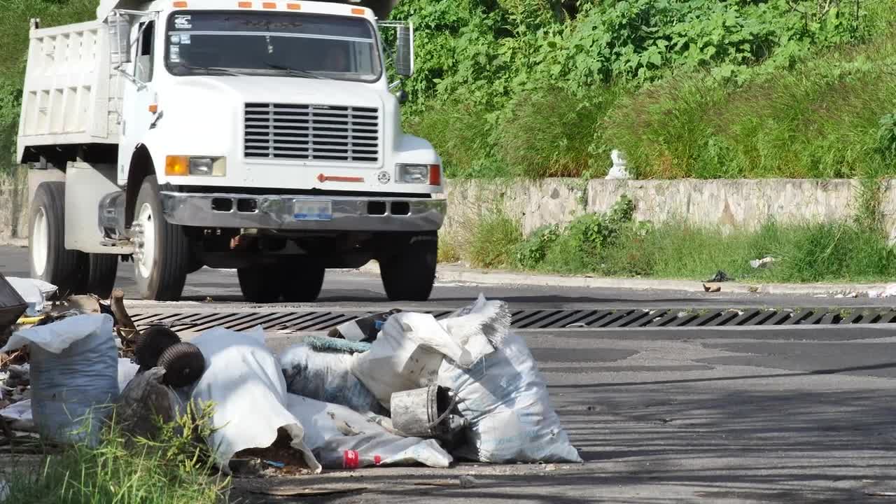 Free Stock Video Rubbish Piled Up On A Street Sidewalk Live Wallpaper - Free Download