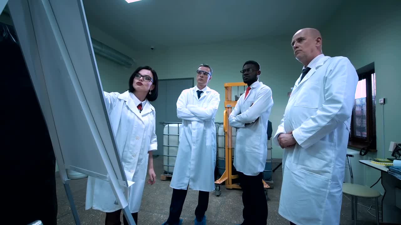 Stock Video Female Scientist Explaining An Idea On The Board Live Wallpaper For PC - Free Download