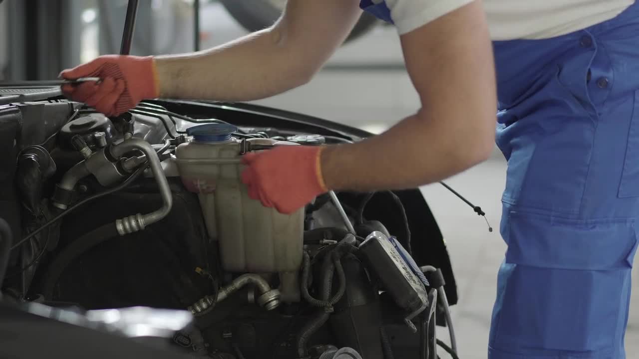 Stock Video Mechanic Repairing A Car Engin Animated Wallpaper - Free Download