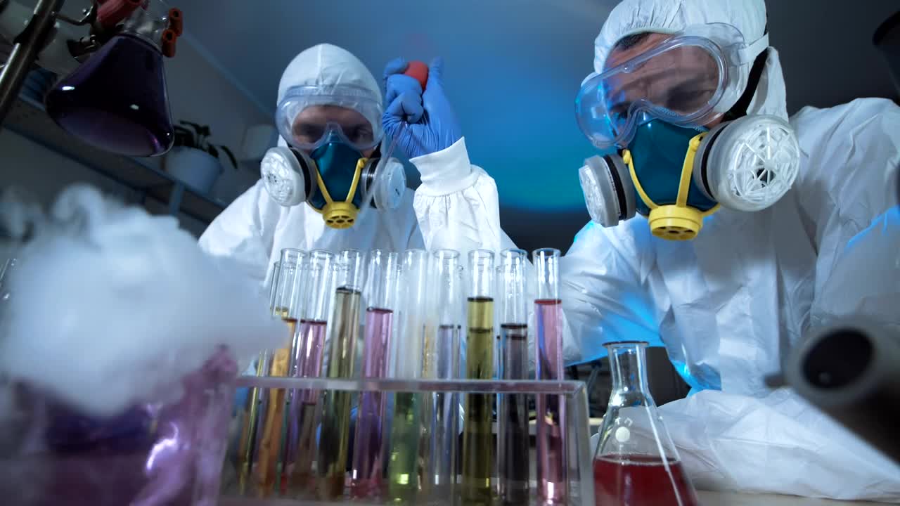 Free Stock Video Scientists With Facemasks Experimenting In The Lab Live Wallpaper - Free Download