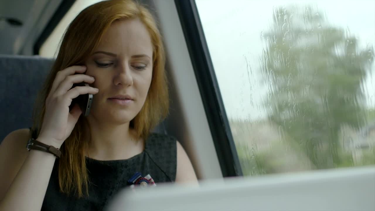 Stock Video Happy Woman Talking On The Phone Inside A Vehicle Animated Wallpaper - Free Download