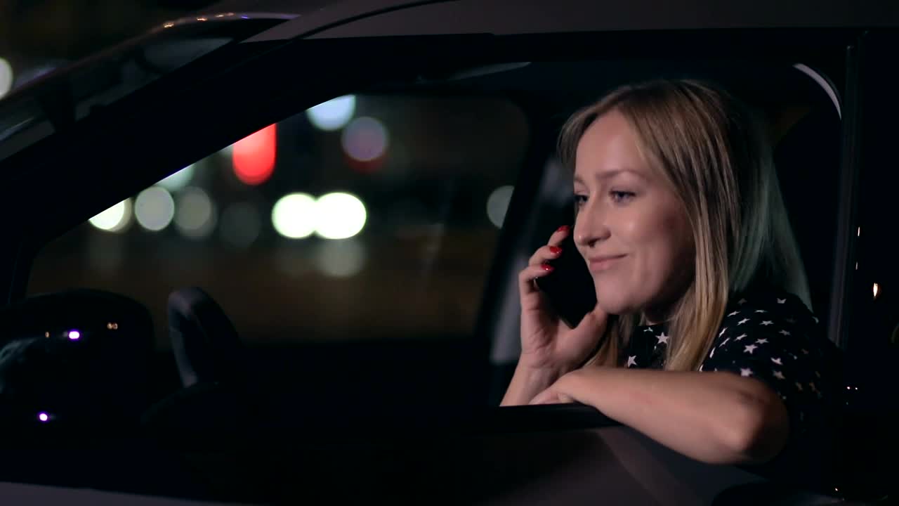 Free Stock Video Woman Answering A Call In Her Car At Night Live Wallpaper - Free Download