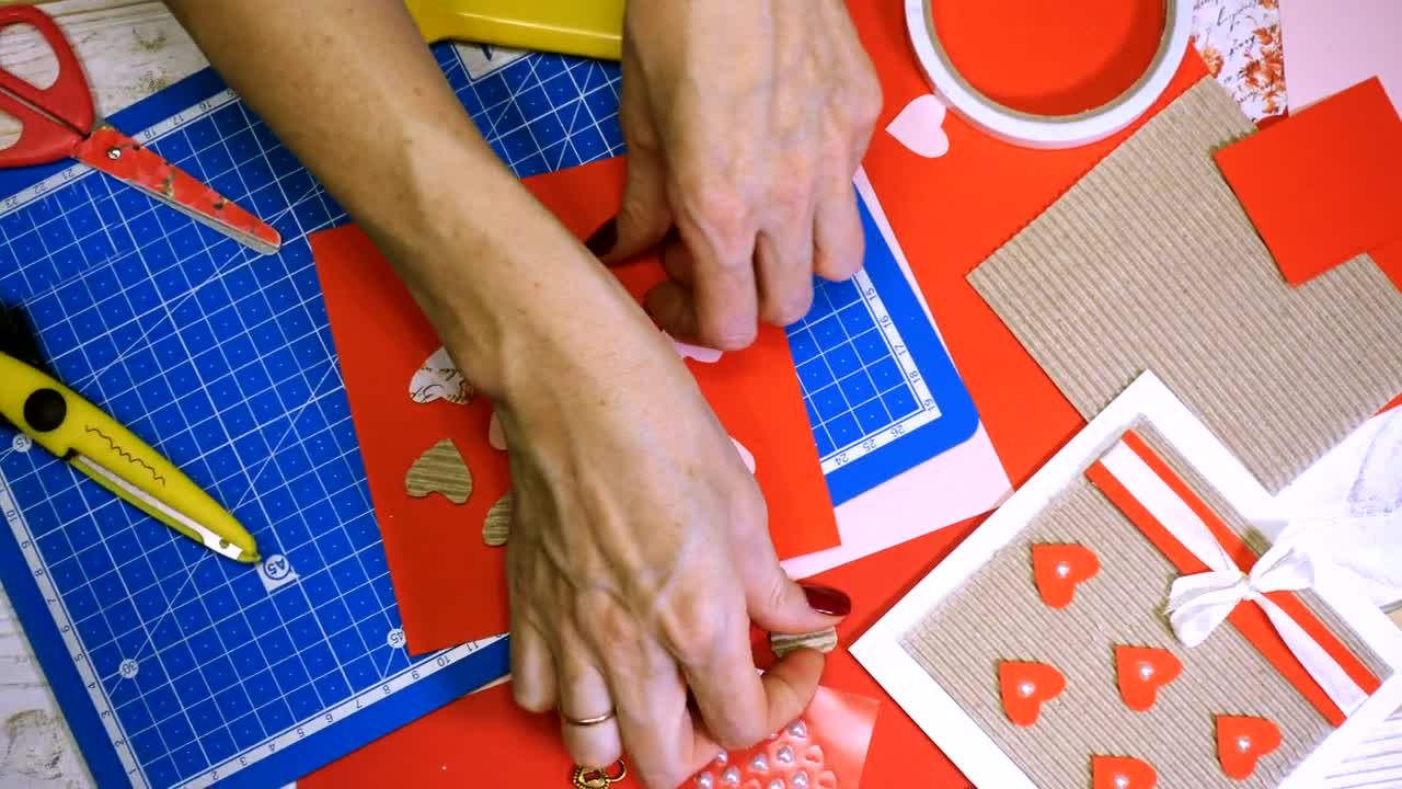 Stock Video Making A St Valentines Card With Paper Cuts Animated Wallpaper - Free Download