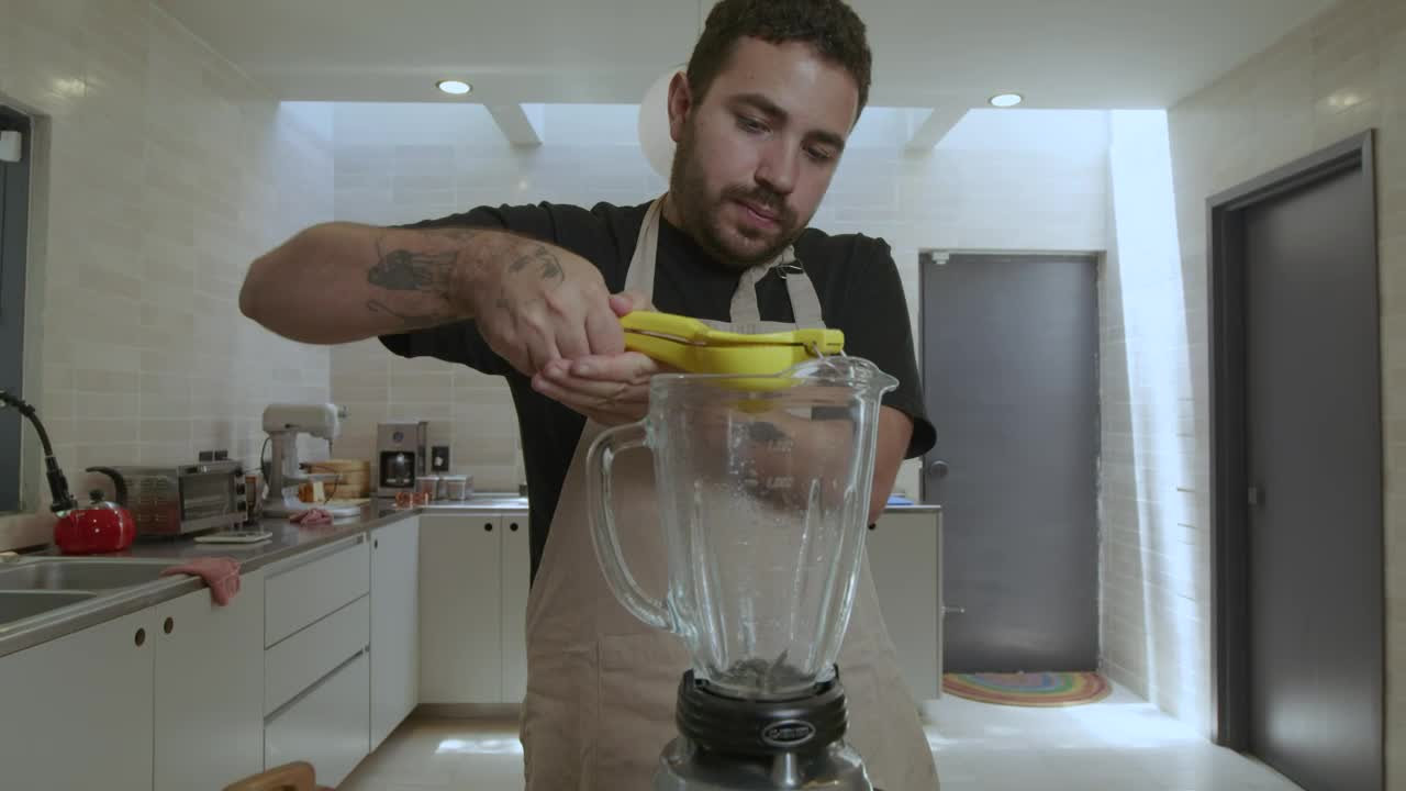 Stock Video Cook Adding Lemon To A Blender Live Wallpaper For PC - Free Download