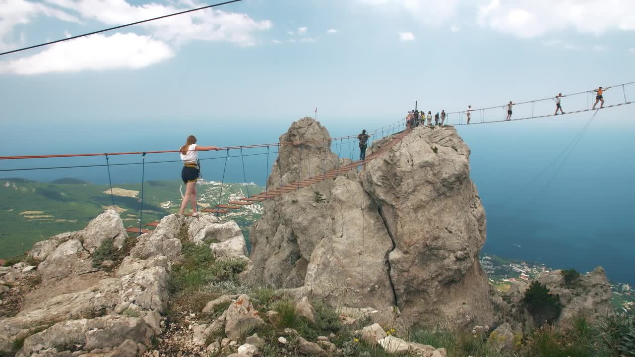 Free Stock Video Woman Crossing A Suspension Bridge In The Mountains Live Wallpaper - Free Download