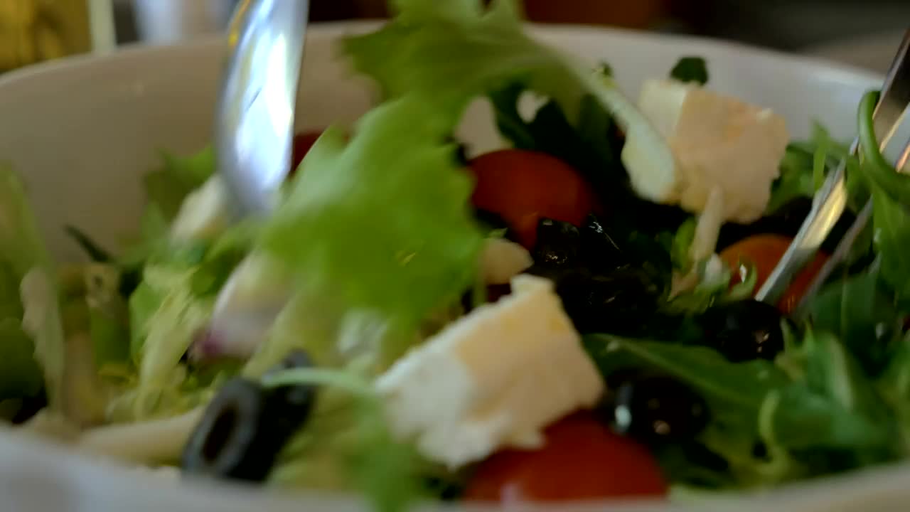 Stock Video Mixing Up A Greek Salad Ready For Servin Animated Wallpaper - Free Download