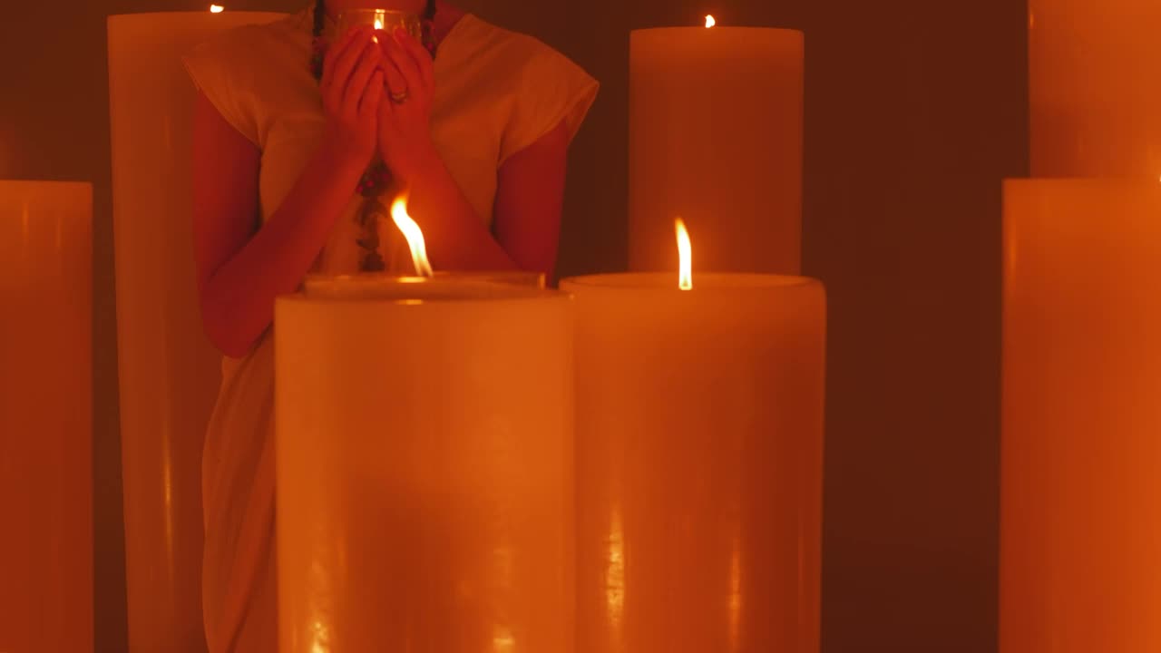 Free Video Stock Spiritual Woman Meditating Among Many Candles Live Wallpaper - Free Download