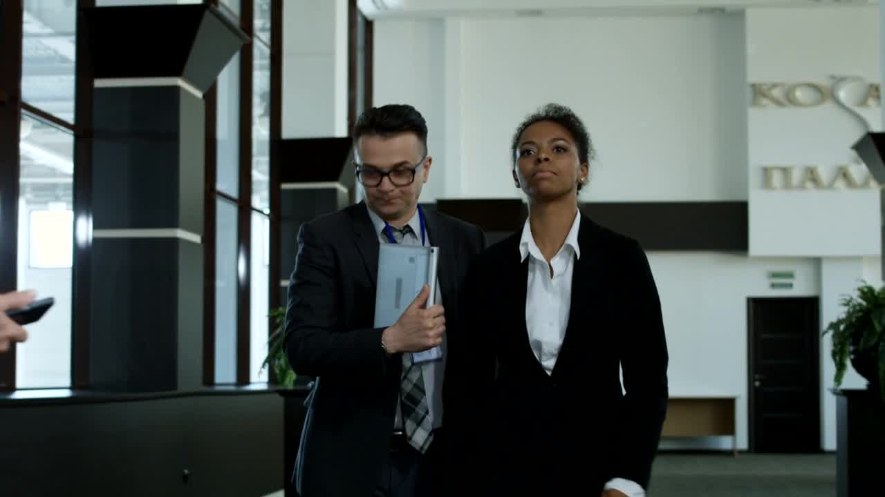 Stock Footage Woman Avoiding Journalists In The Hallway Live Wallpaper - Free Download