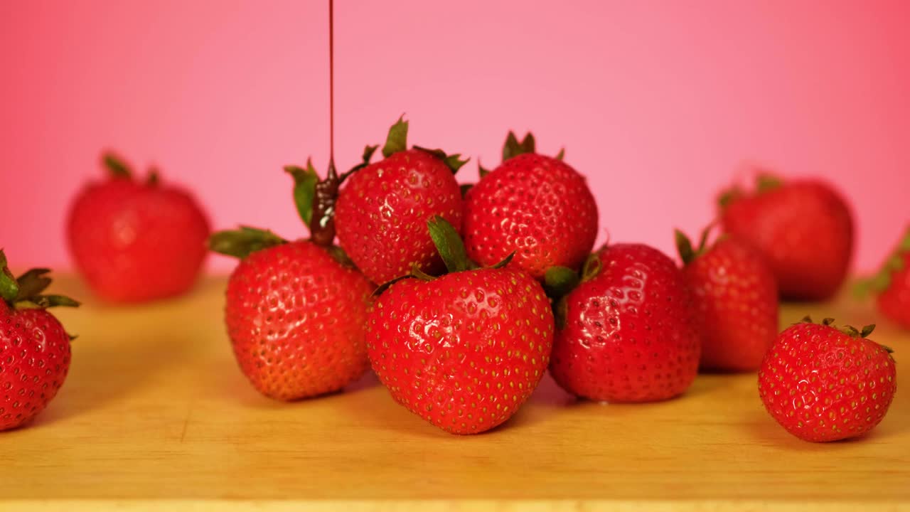 Free Video Stock Strawberries Are Covered In Chocolate On A Pink Background Live Wallpaper - Free Download