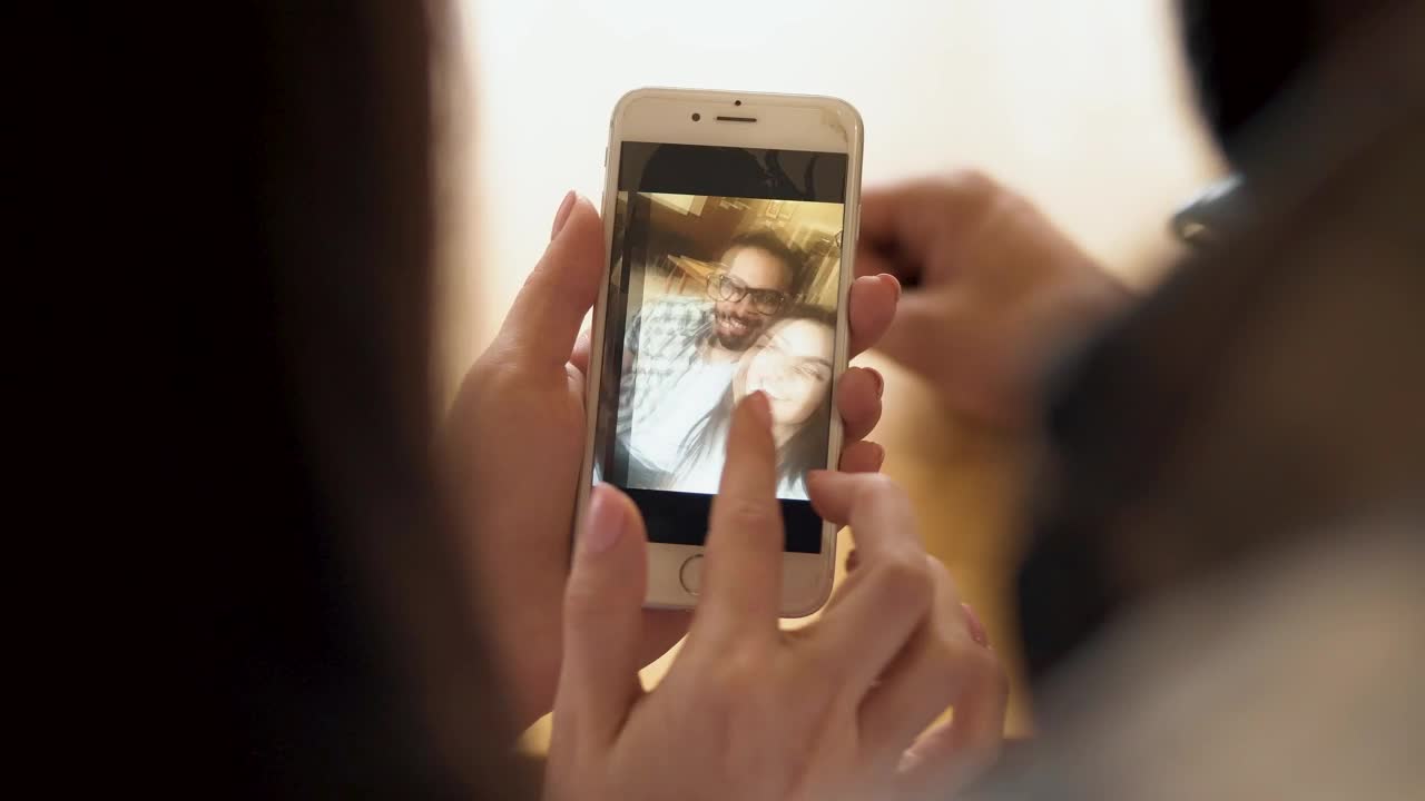 Stock Video Couple Looking At Selfies In Their Cell Phone Live Wallpaper For PC - Free Download
