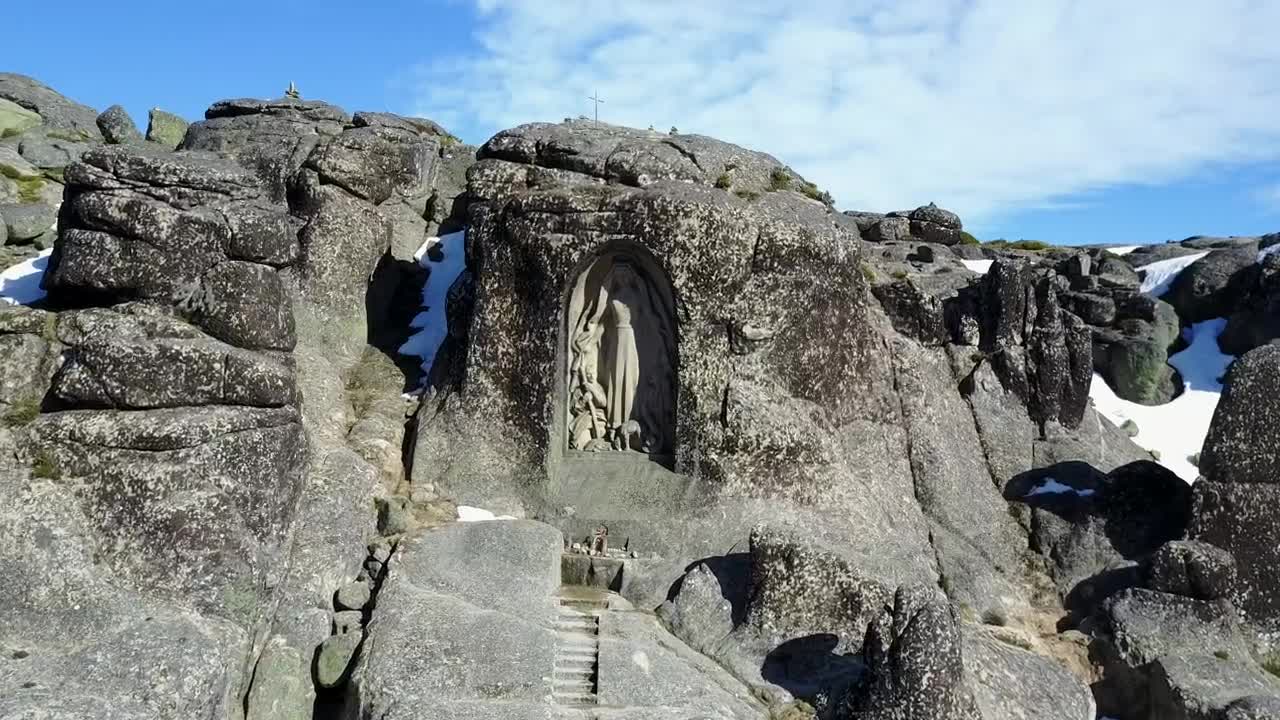 Stock Video Flying Towards A Statue Encrusted In The Rocks Live Wallpaper For PC - Free Download