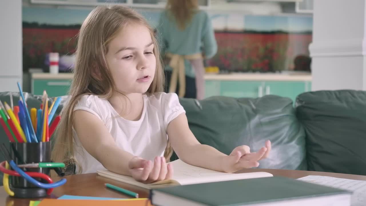Stock Video Little Girl Studying Mathematics In Her Living Room Animated Wallpaper - Free Download