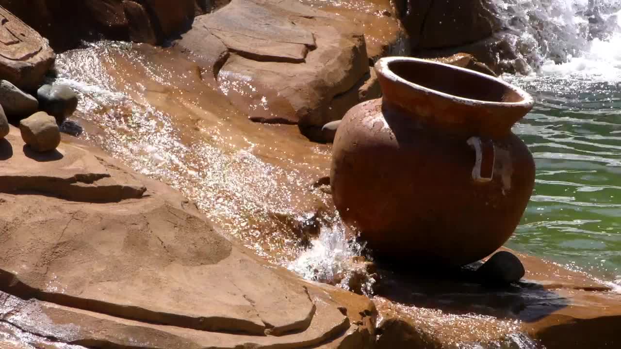 Stock Video Crock Pot Atop A Small Rock Waterfall Live Wallpaper For PC - Free Download