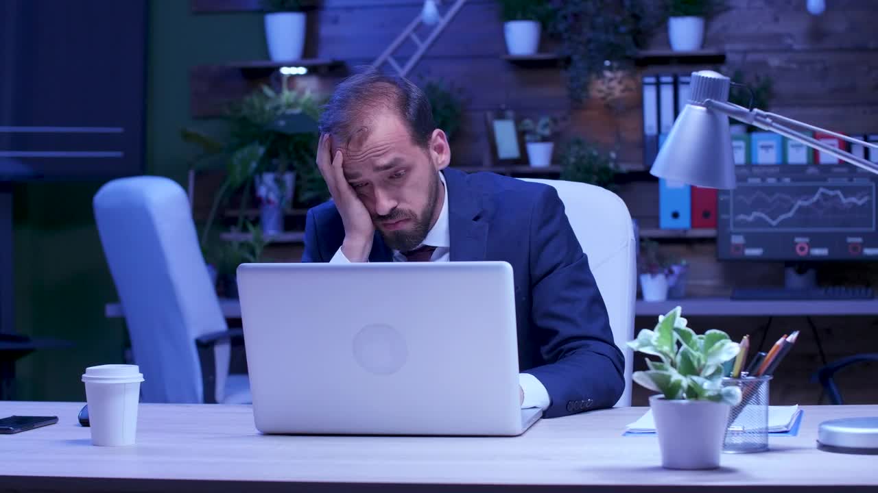 Free Video Stock Stressed Businessman Rubs Eyes While Working On Laptop Live Wallpaper - Free Download