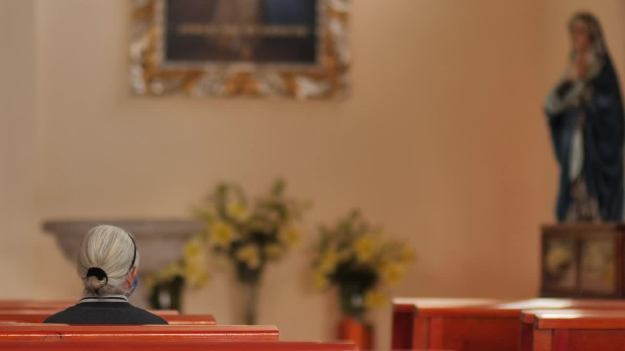 Stock Video Elderly Woman Sitting On A Pew In A Church Live Wallpaper For PC - Free Download