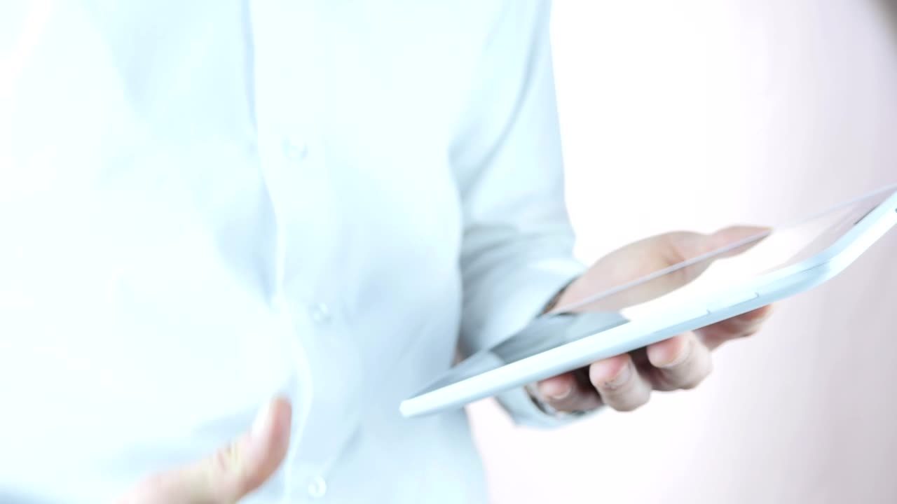 Stock Video Man Holding A Tablet Makes A Thumb Up Sign Animated Wallpaper - Free Download