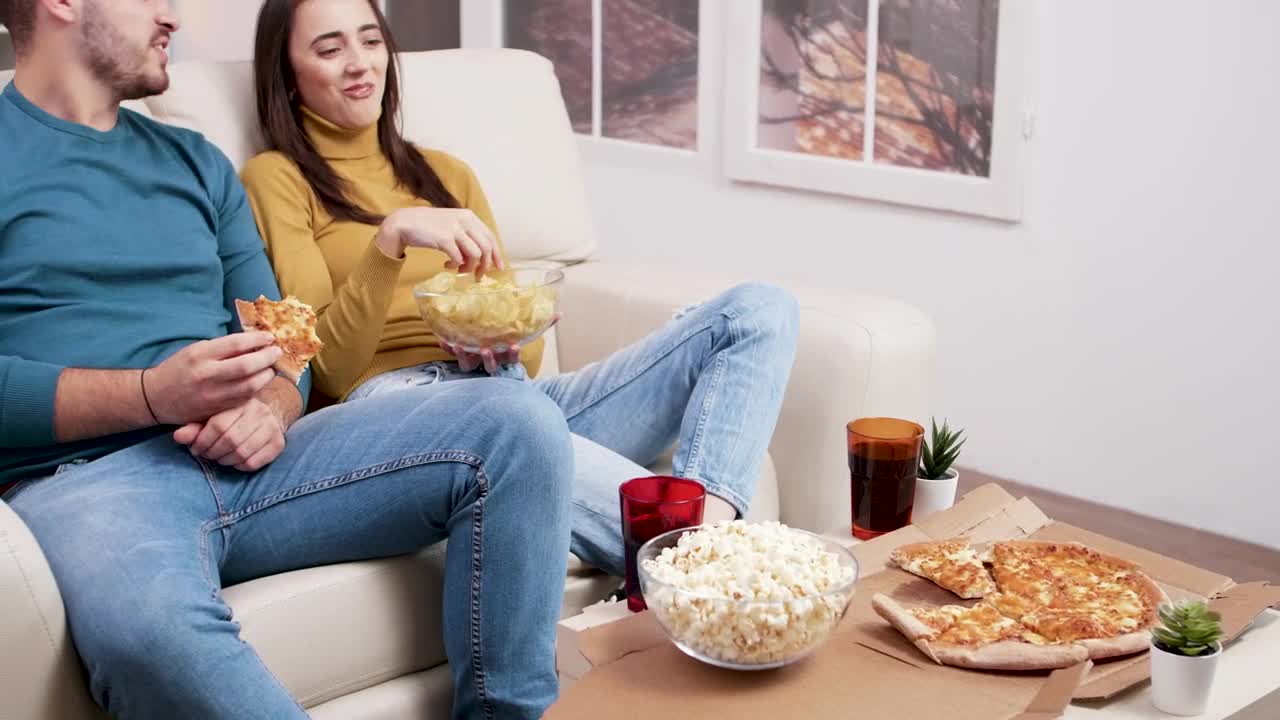 Stock Video Couple Sharing A Pizza And Popcorn Live Wallpaper For PC - Free Download