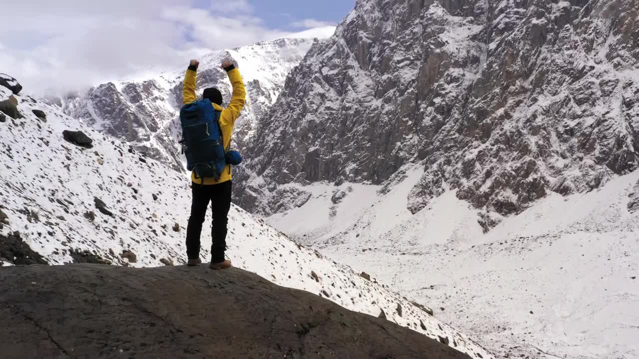 Stock Video Mountaineer Celebrating With Raised Arms In The Mountains Live Wallpaper - Free Download