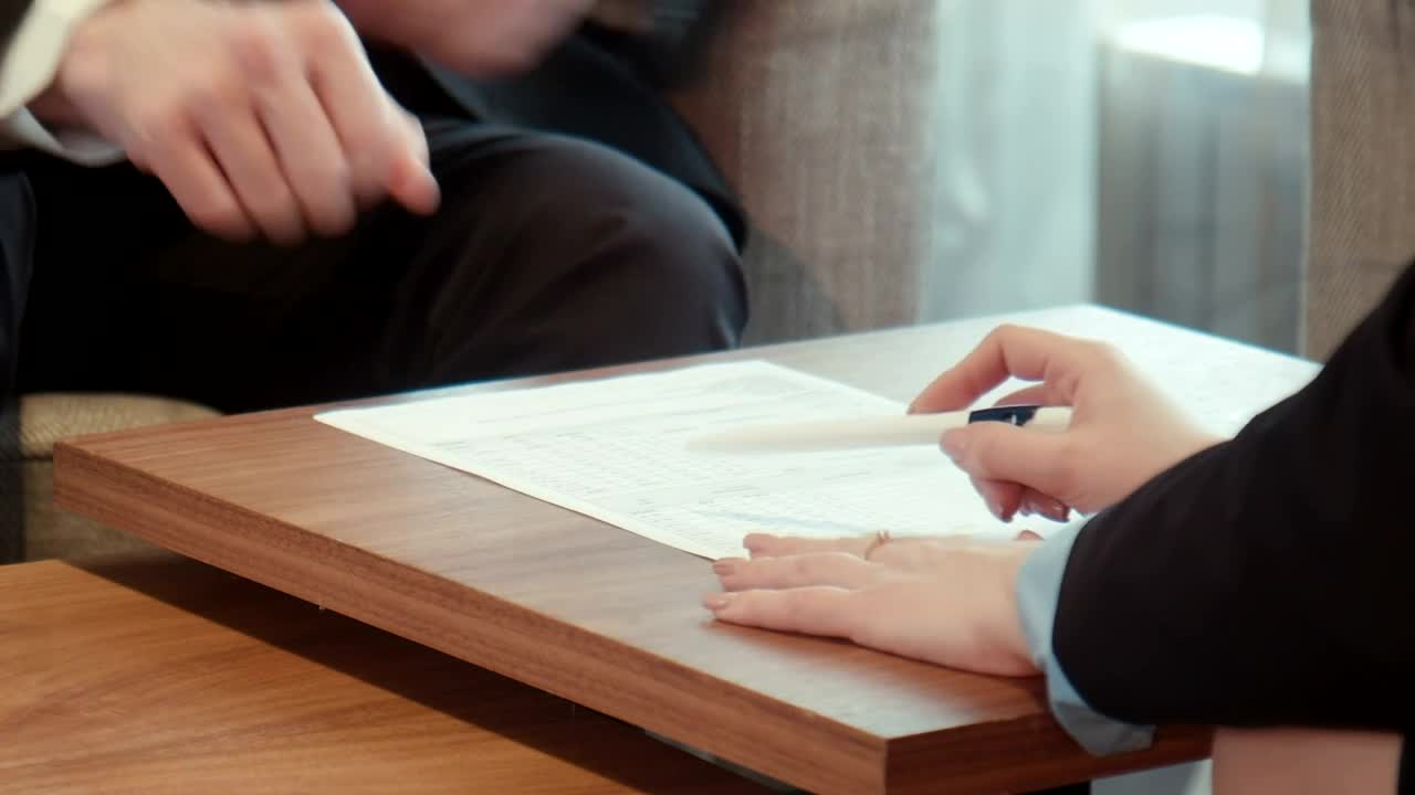Free Stock Video Signing On A Contract On A Wooden Table Live Wallpaper - Free Download