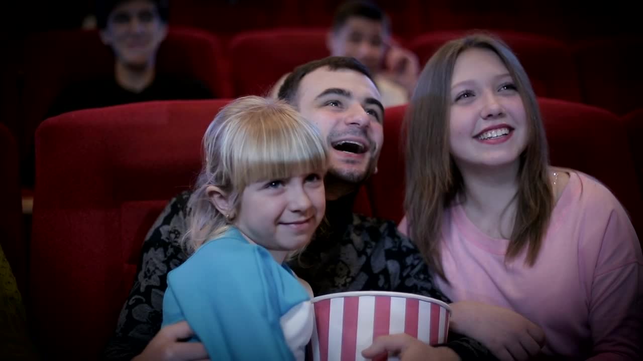 Stock Video Family Enjoying A Movie At The Cinema Live Wallpaper For PC - Free Download