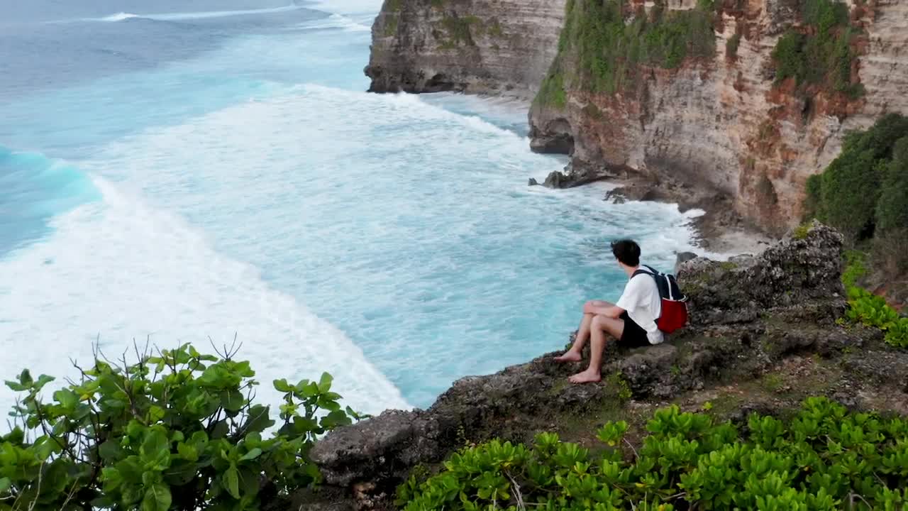 Stock Video Man Looking Out To Sea From A High Clif Animated Wallpaper - Free Download