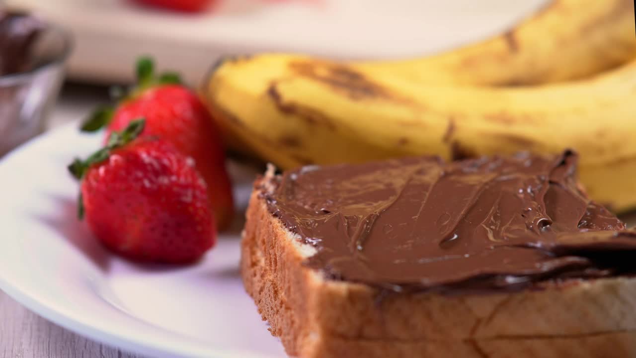Free Video Stock Spreading Hazelnut Cream On White Bread Live Wallpaper - Free Download