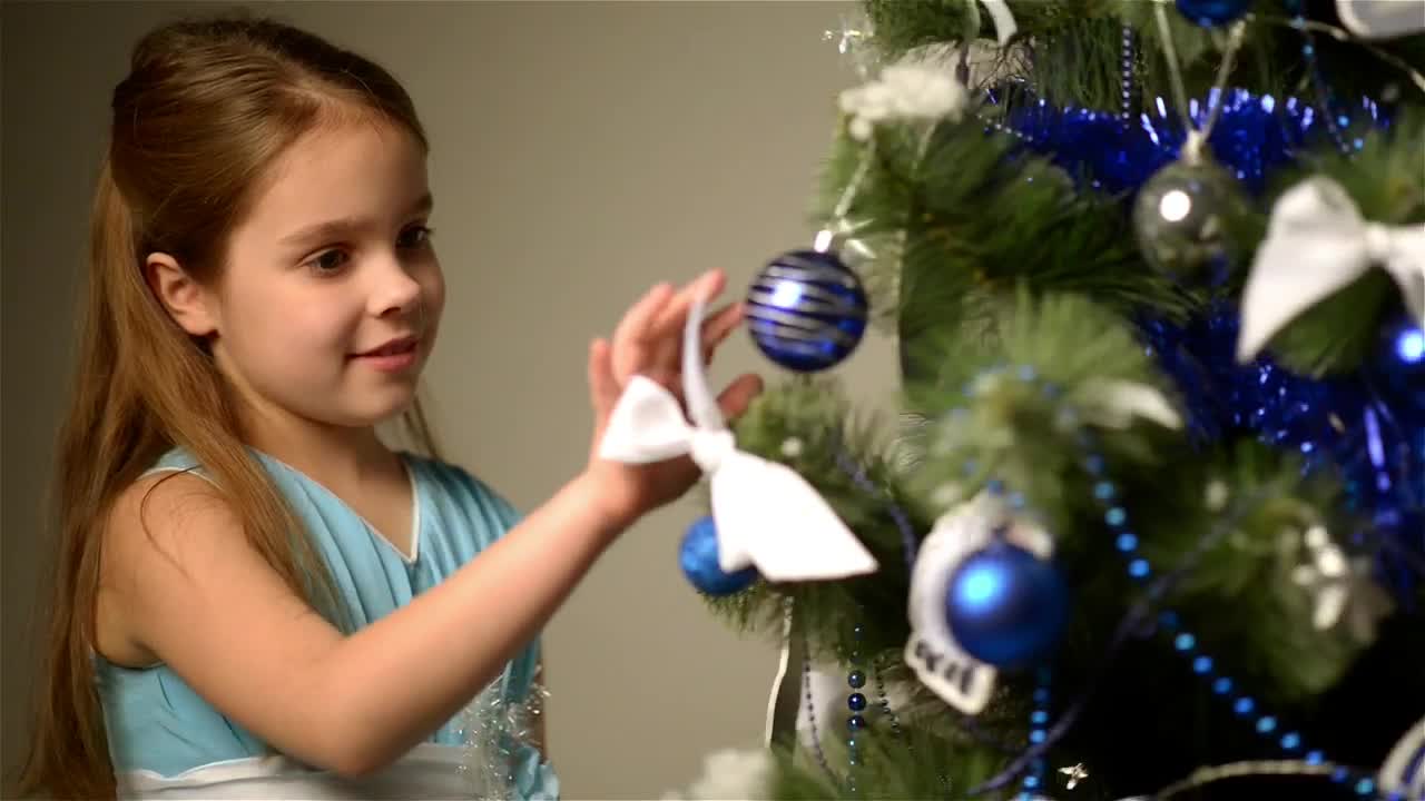 Stock Video Happy Little Girl Next To A Christmas Tree Animated Wallpaper - Free Download