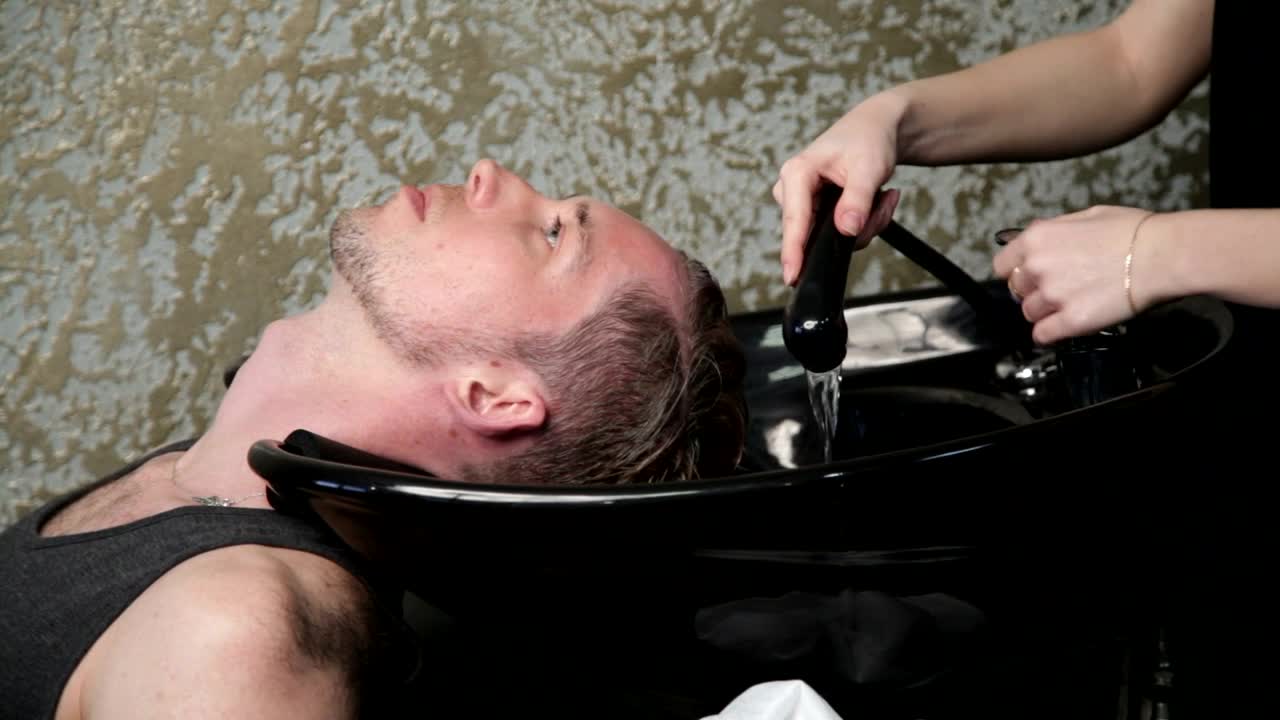 Stock Video Hairdresser Washing A Mans Hair Live Wallpaper For PC - Free Download