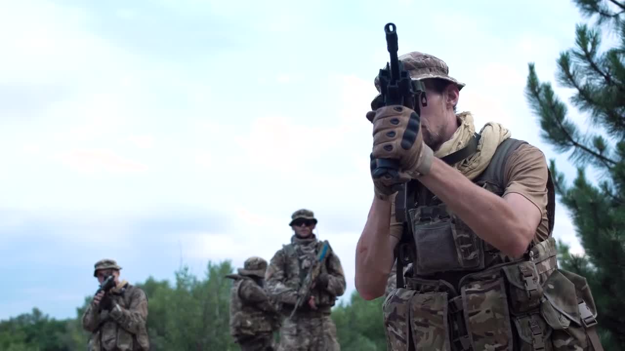 Stock Video Ilitary Men Walking Cautiously On The Battlefield Animated Wallpaper - Free Download