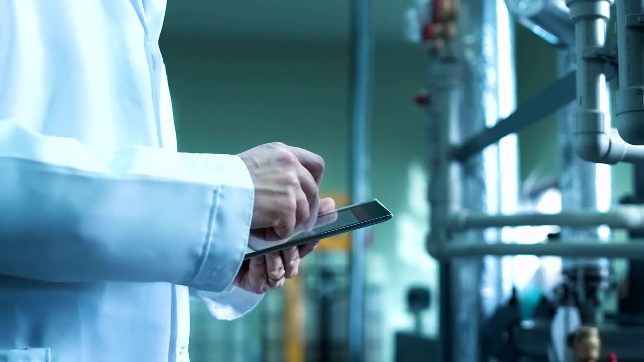 Stock Video Man Using A Tablet In An Industrial Environmen Animated Wallpaper - Free Download