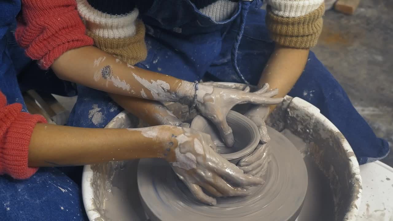 Stock Video Hands Of Two Girlfriends Shaping A Vase With Clay Animated Wallpaper - Free Download