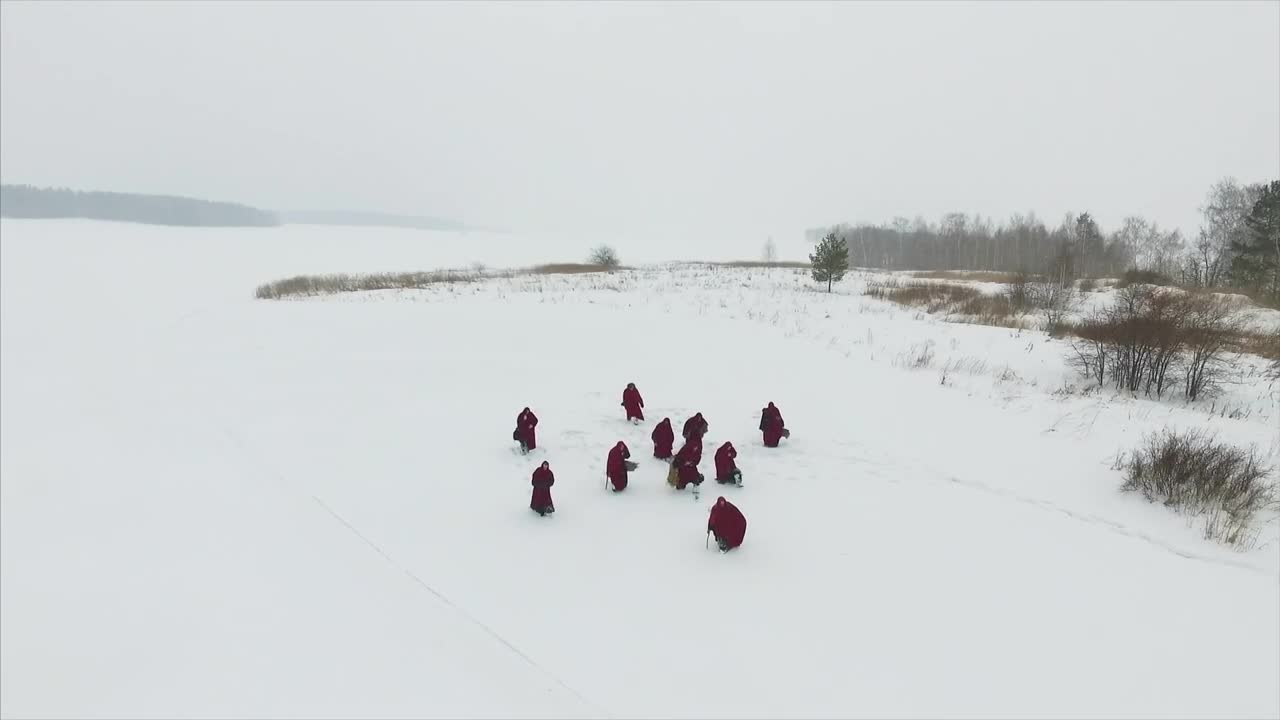 Stock Video Monks Walking Through The Sno Animated Wallpaper - Free Download