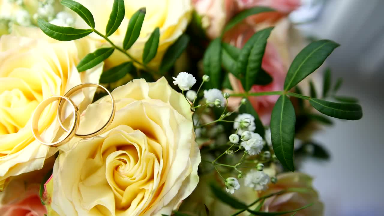 Stock Footage Wedding Rings Over Yellow Flowers Live Wallpaper - Free Download