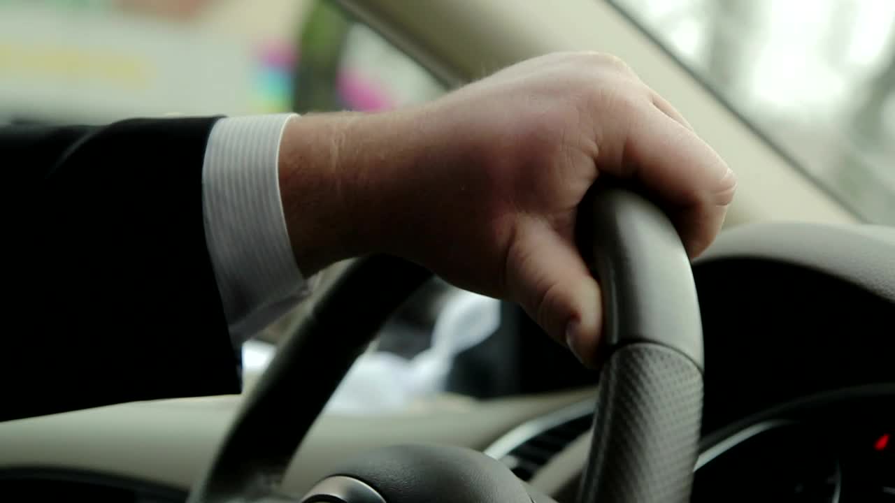 Stock Video Holding The Steering Wheel Of A Car While Driving Animated Wallpaper - Free Download