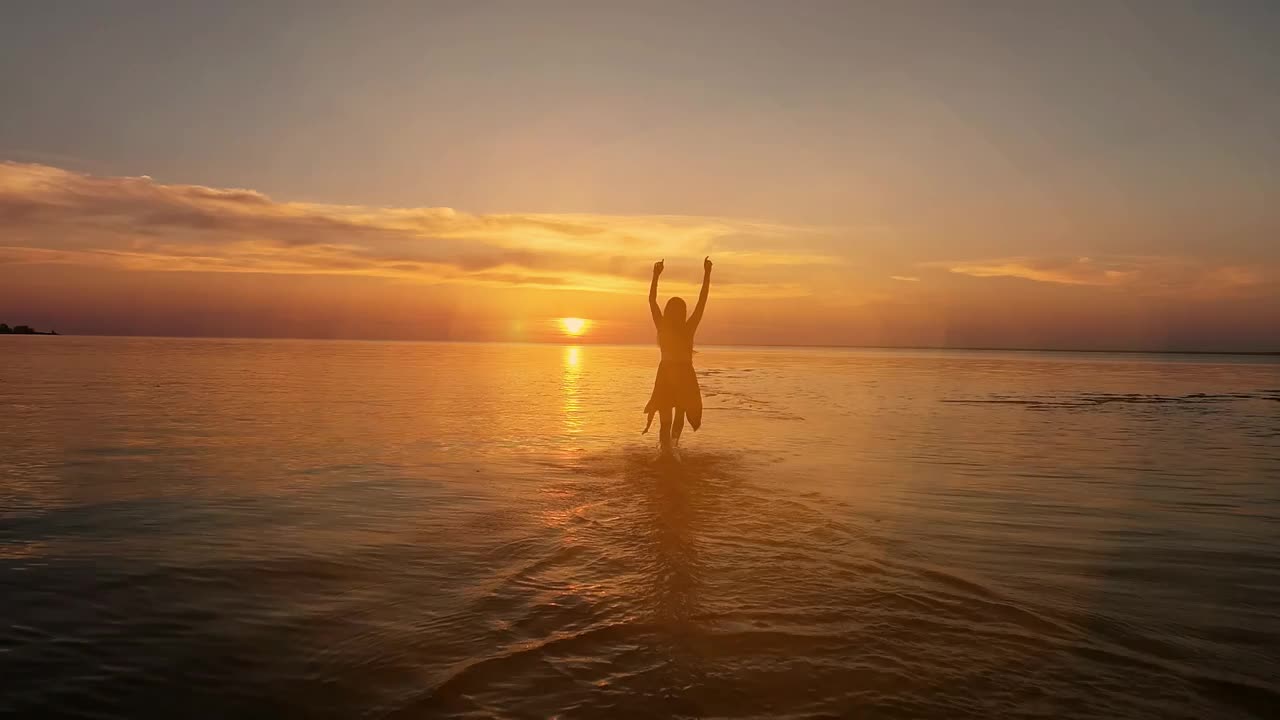 Stock Video Excited Woman Running Towards The Sunset At The Seaside Live Wallpaper For PC - Free Download