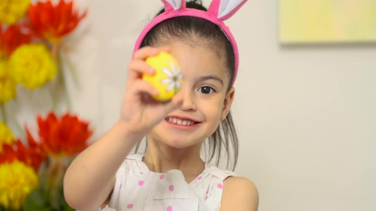 Stock Video Happy Little Girl Showing An Easter Egg Animated Wallpaper - Free Download