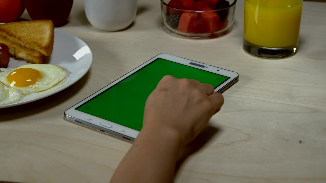 Stock Footage Woman Browsing On A Tablet Live Wallpaper - Free Download