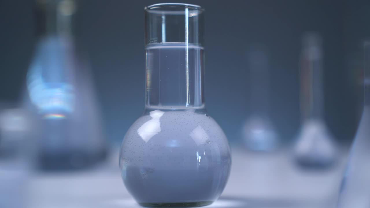 Stock Video Laboratory Flasks With Gray Liquid Animated Wallpaper - Free Download