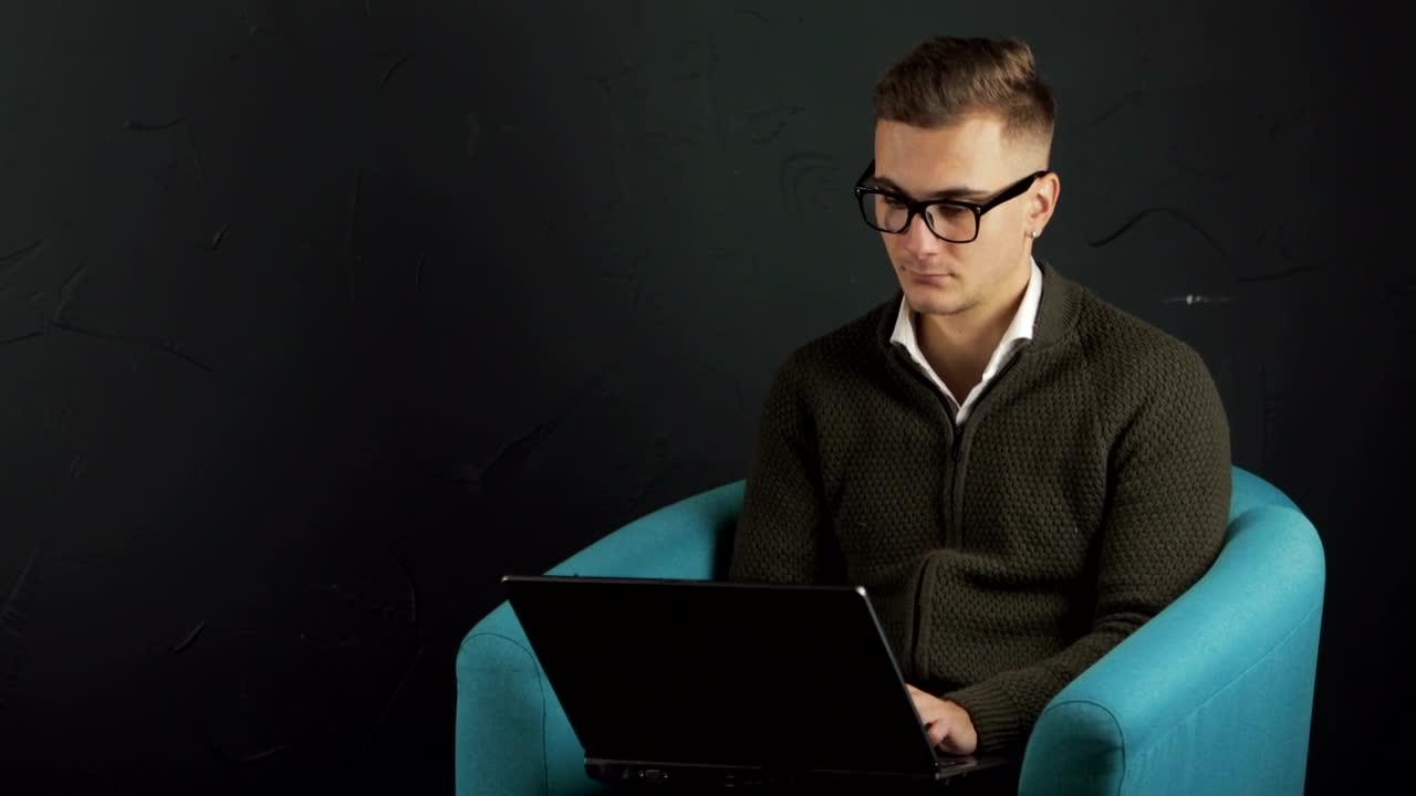 Stock Video Man Typing On Laptop With Black Backgroun Animated Wallpaper - Free Download